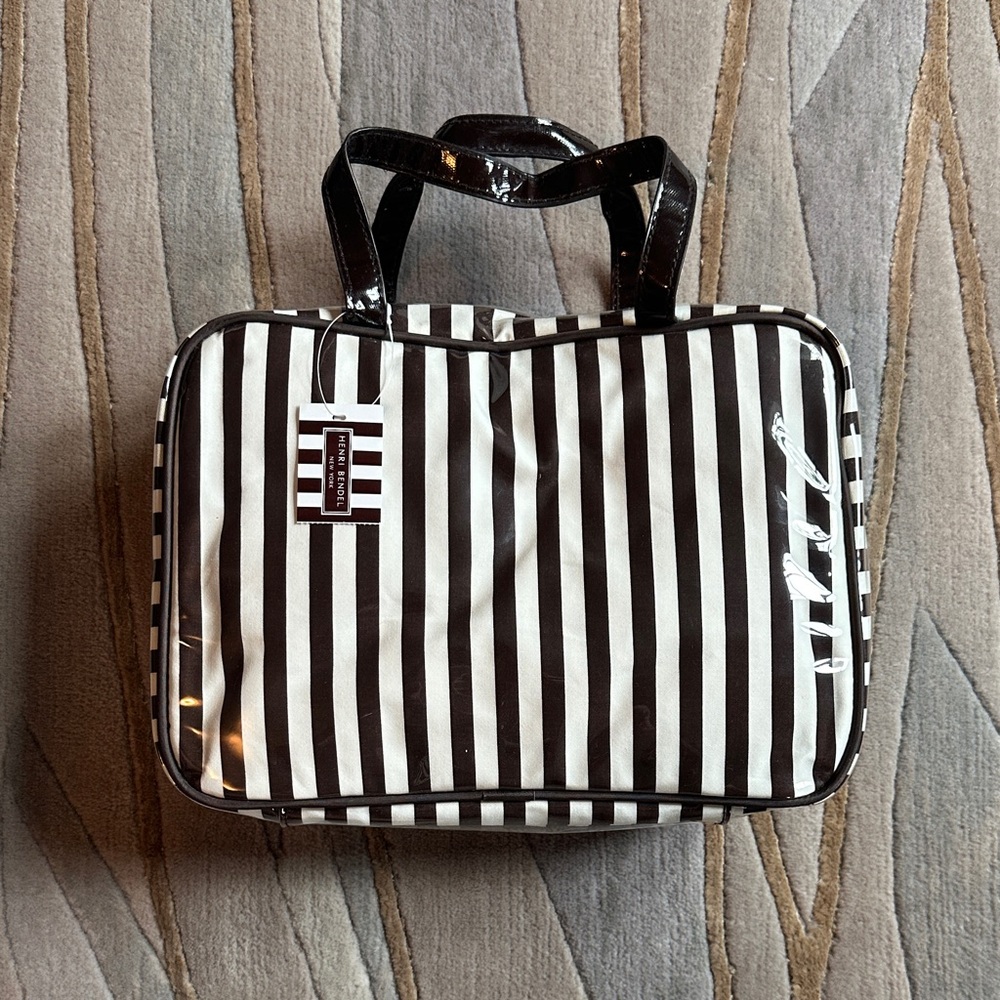 Striped Brown and white Henry Bendel large weekender bag.
